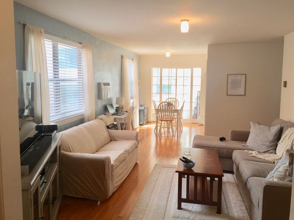 A living room with a couch and a coffee table