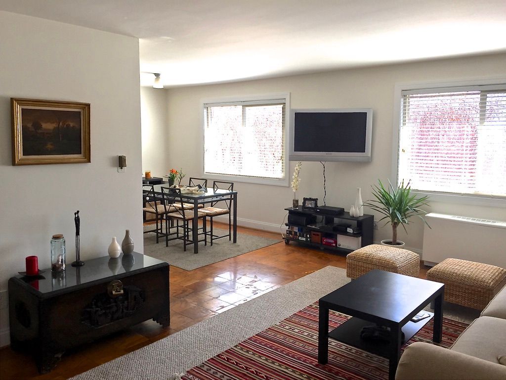 A living room filled with furniture and a flat screen tv