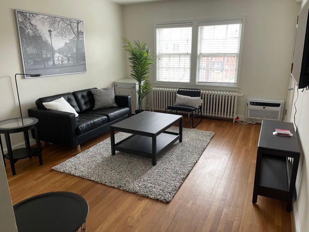 A living room with a couch and a coffee table