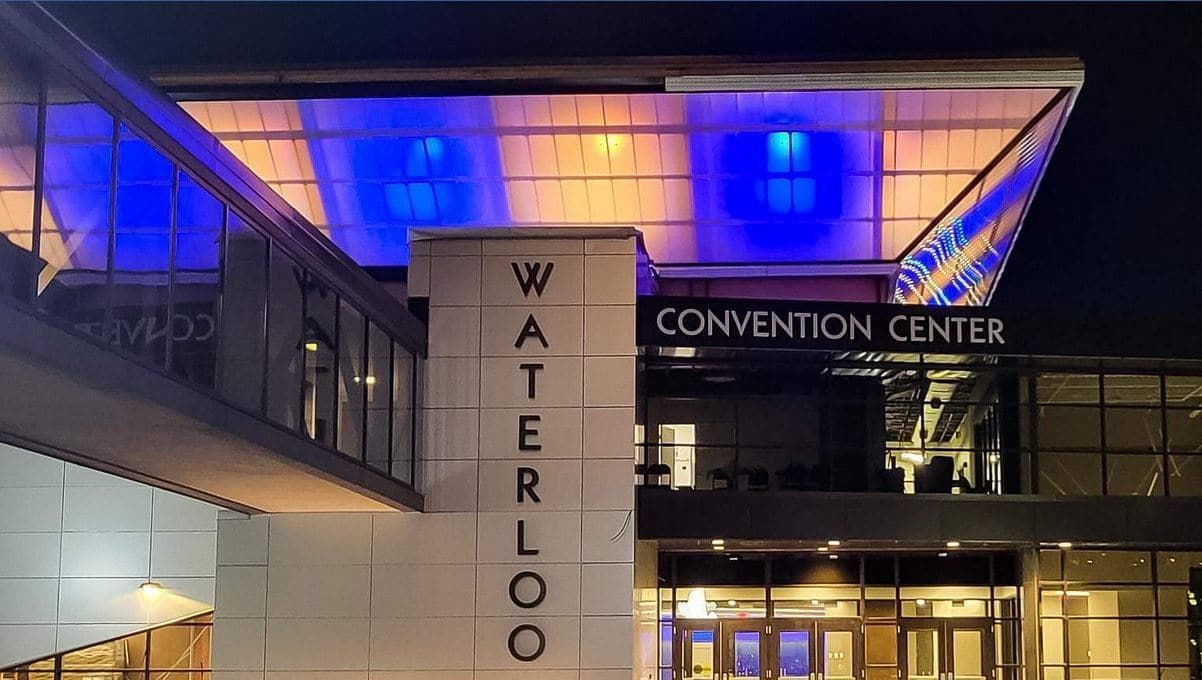 The waterloo convention center is lit up at night