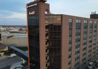 An aerial view of a large brick building with a lot of windows