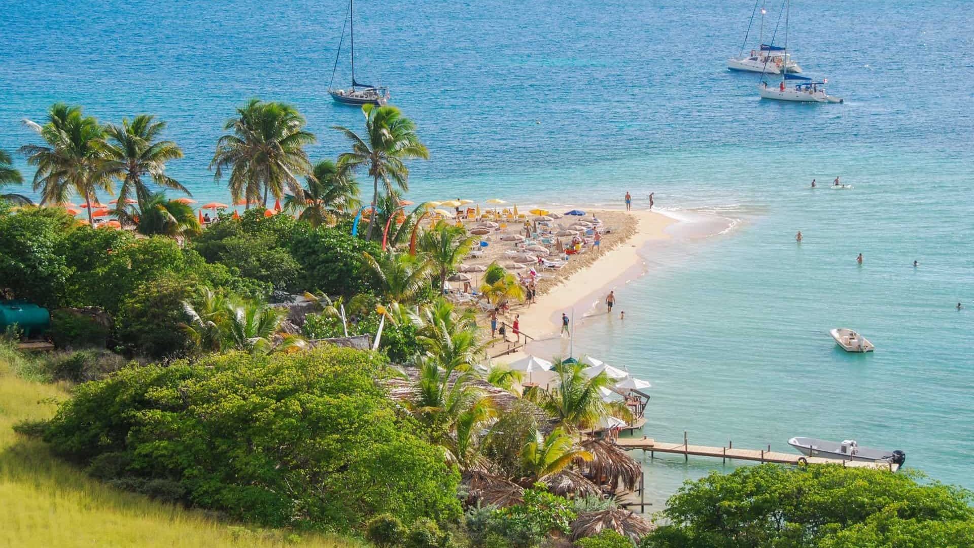 View of the main beach of Pinel island from above.