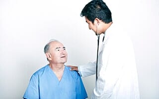 A young Doctor comforting a Senior adult patient — one-stop surgical and non-surgical facility in Orland Park, IL
