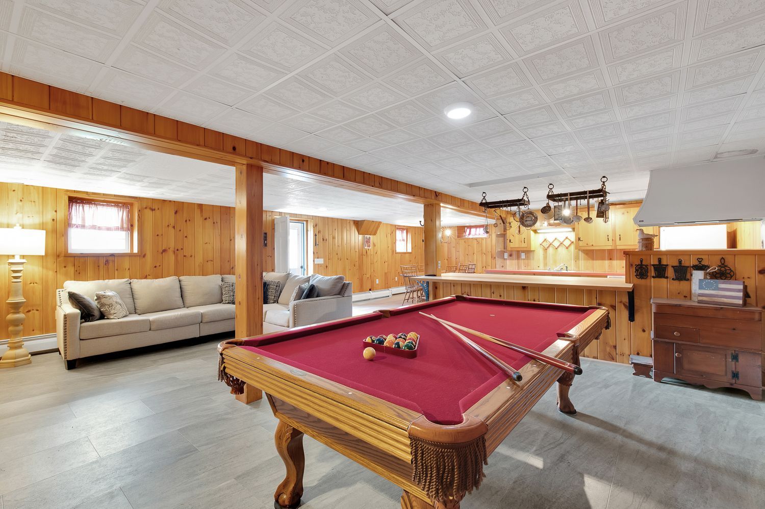 There is a pool table in the middle of the room.