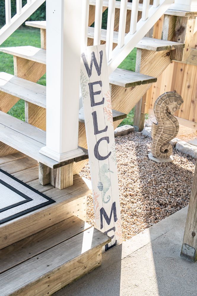 There is a welcome sign on the side of the stairs.
