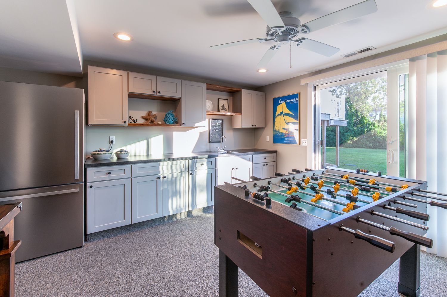 There is a foosball table in the middle of the room.