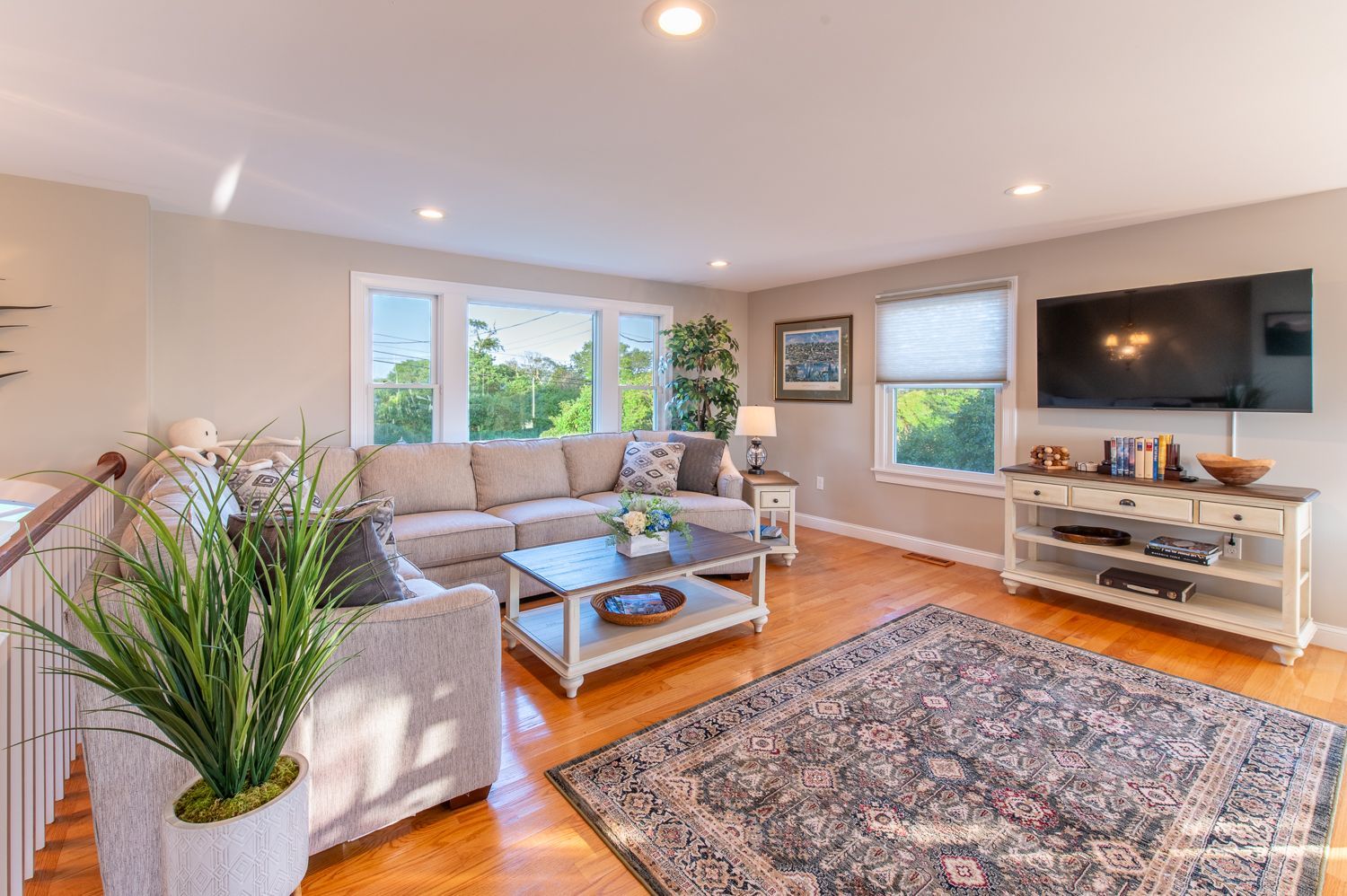 A living room filled with furniture and a flat screen tv.