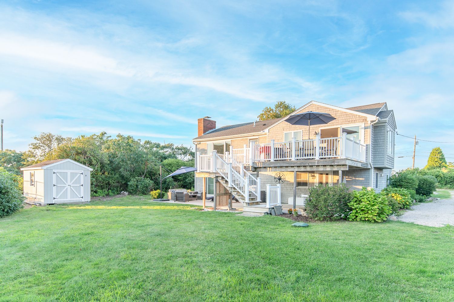 A large house with a large lawn in front of it.