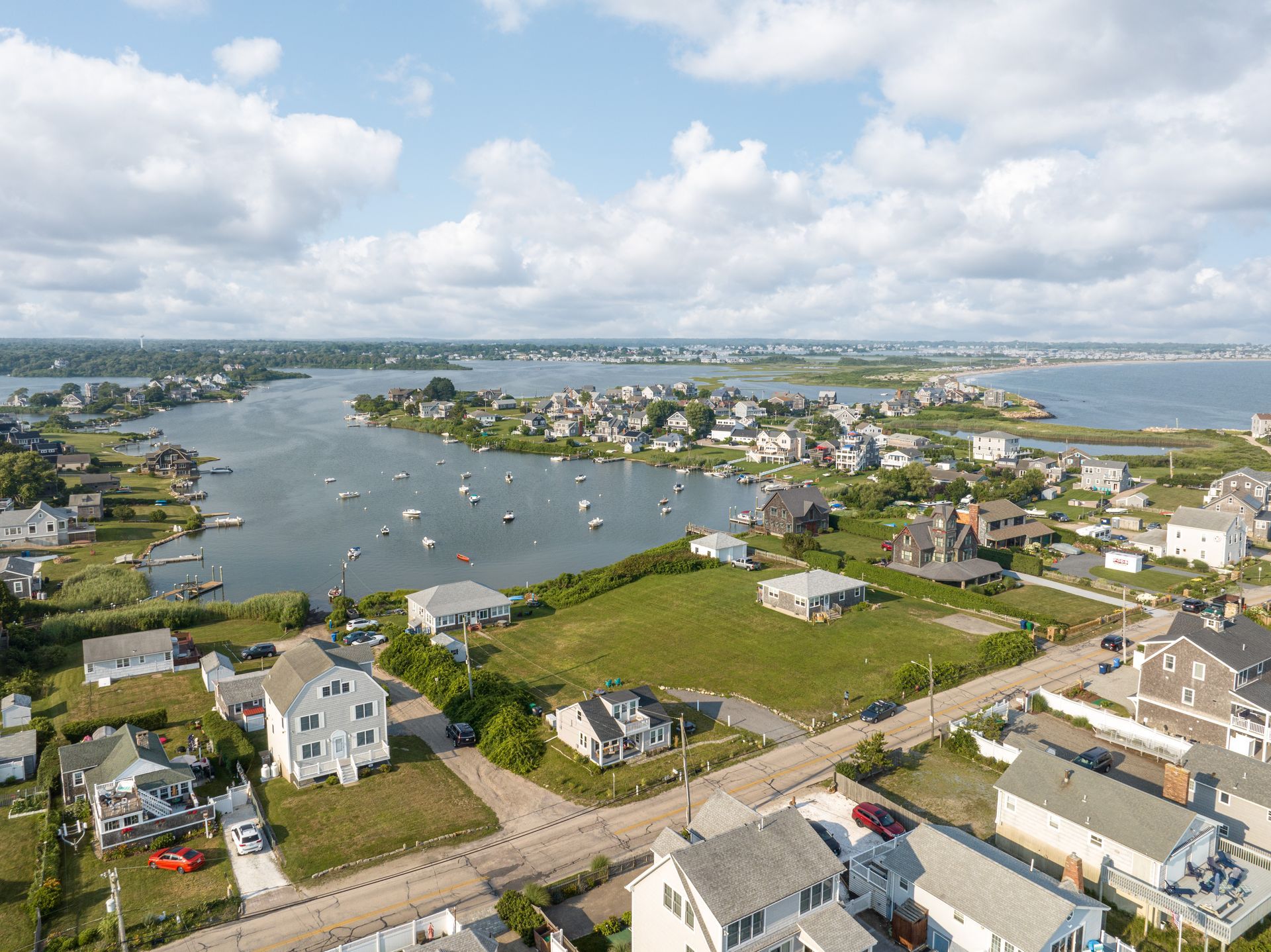 An aerial view of a small town next to a body of water