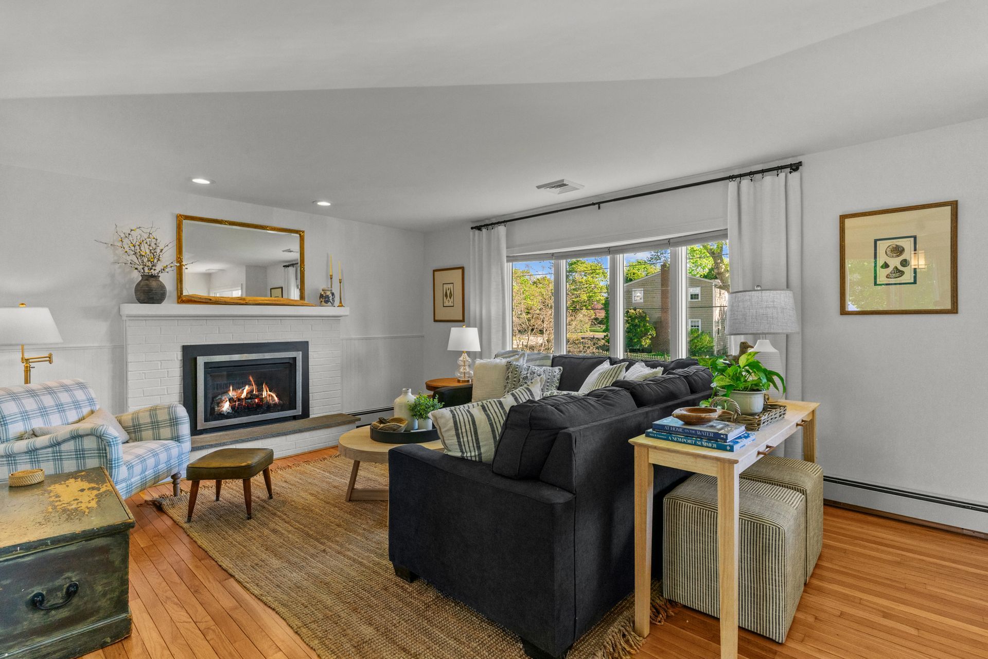 A living room filled with furniture and a fireplace.