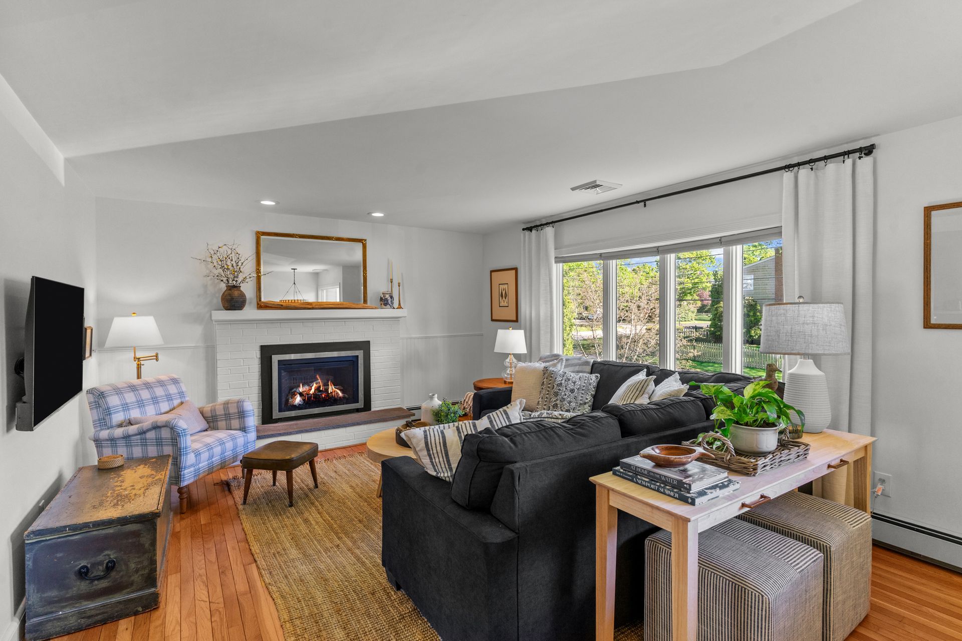 A living room filled with furniture and a fireplace.