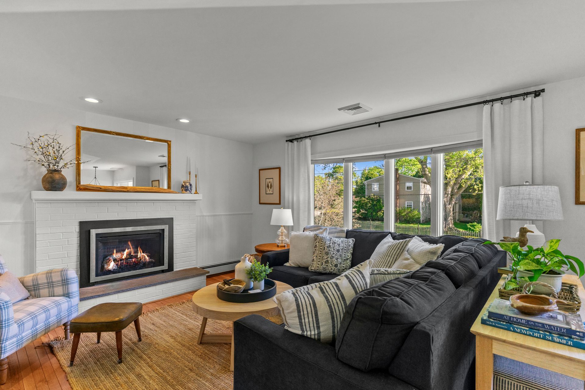 A living room filled with furniture and a fireplace.