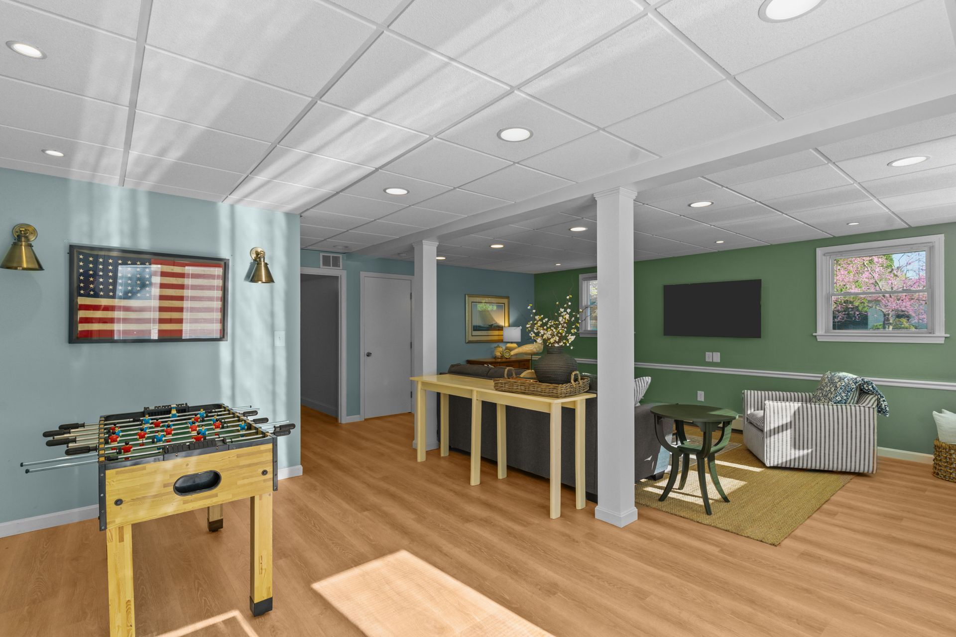 There is a foosball table in the middle of the room.