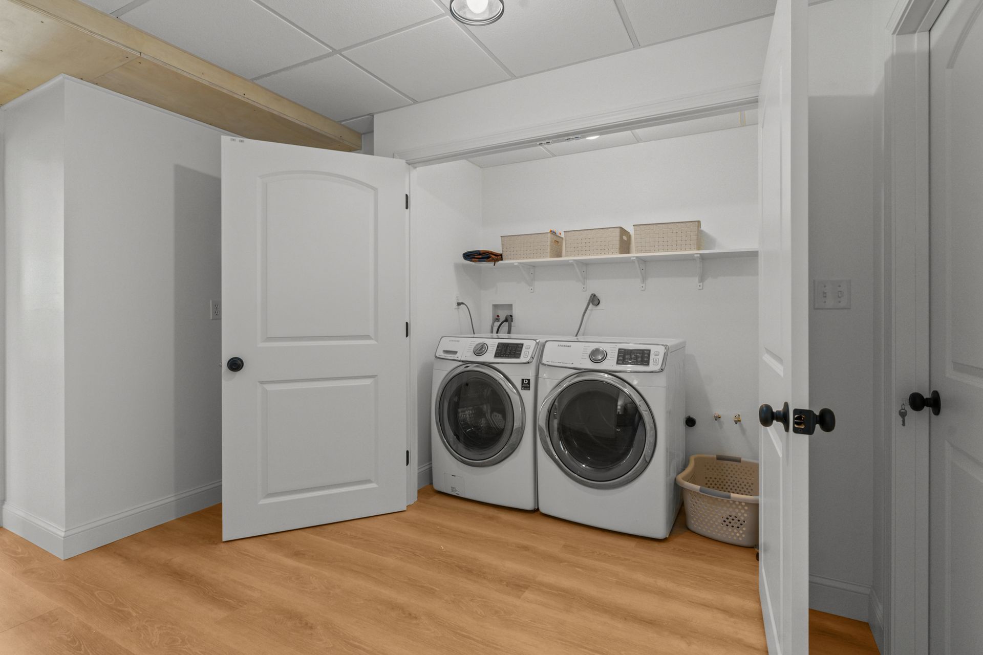 A laundry room with a washer and dryer in it.