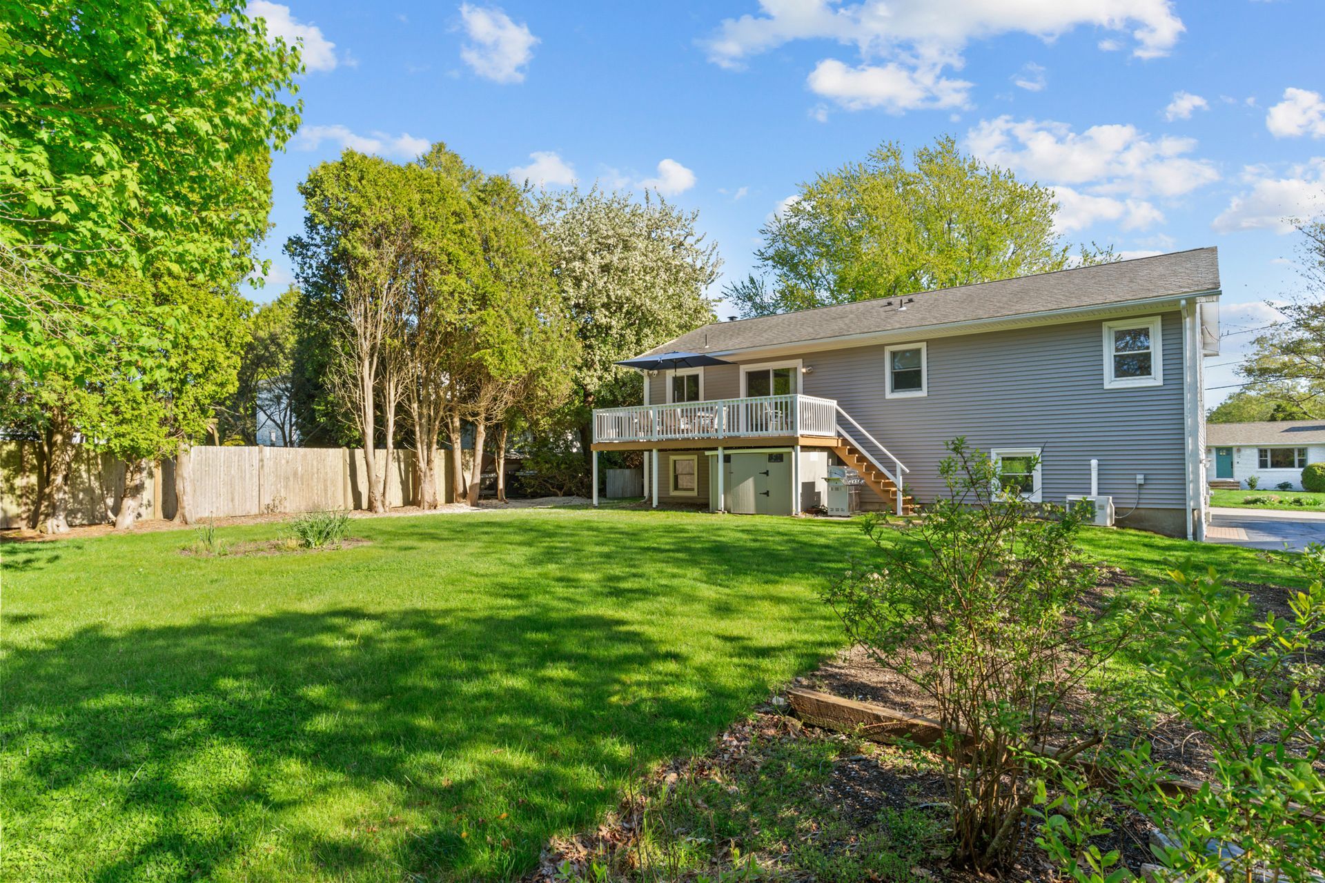 A large house with a large lawn in front of it.