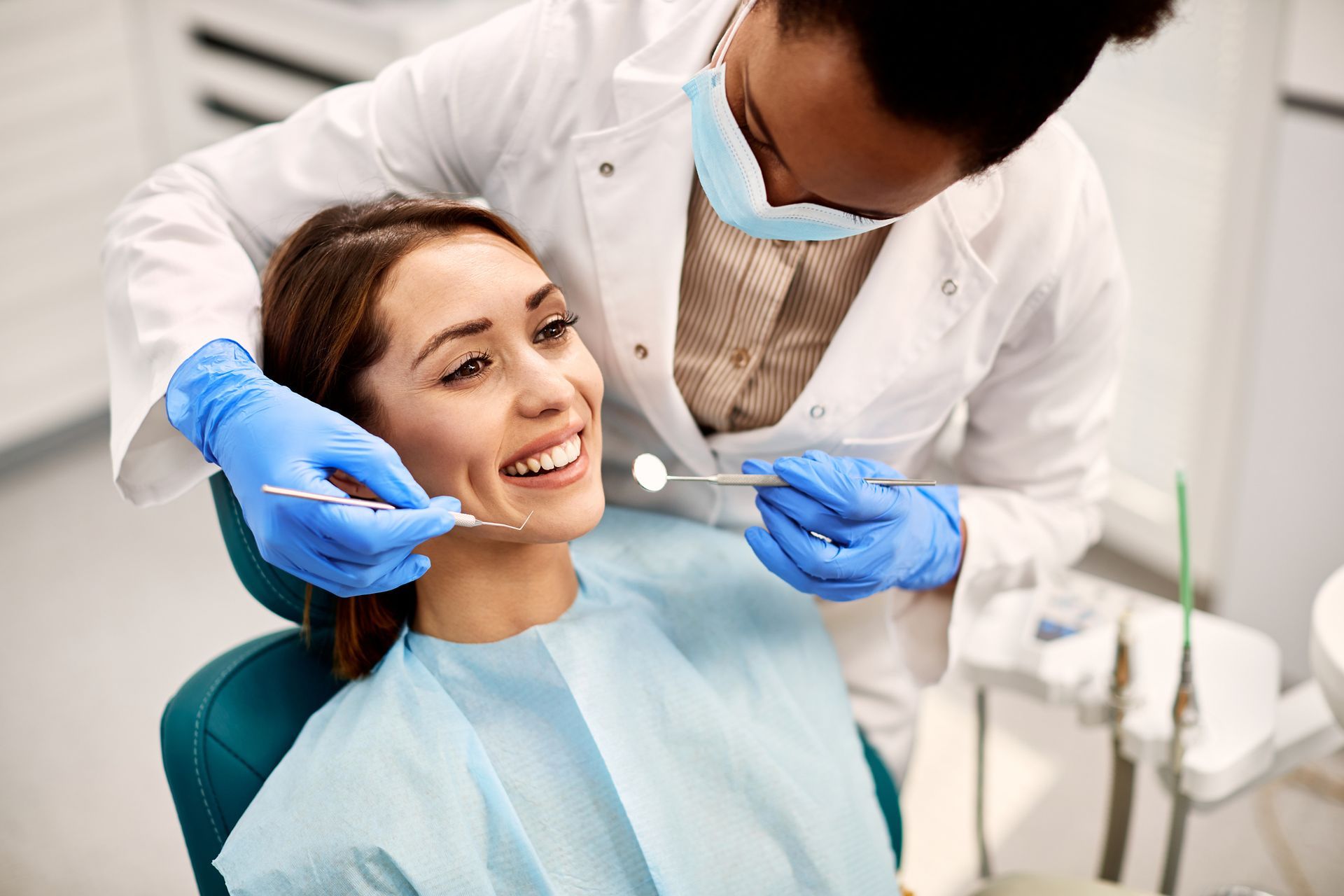 Happy Woman During Dental Procedure — Mermaid Waters, QLD — Gold Coast Dental & Denture Centre