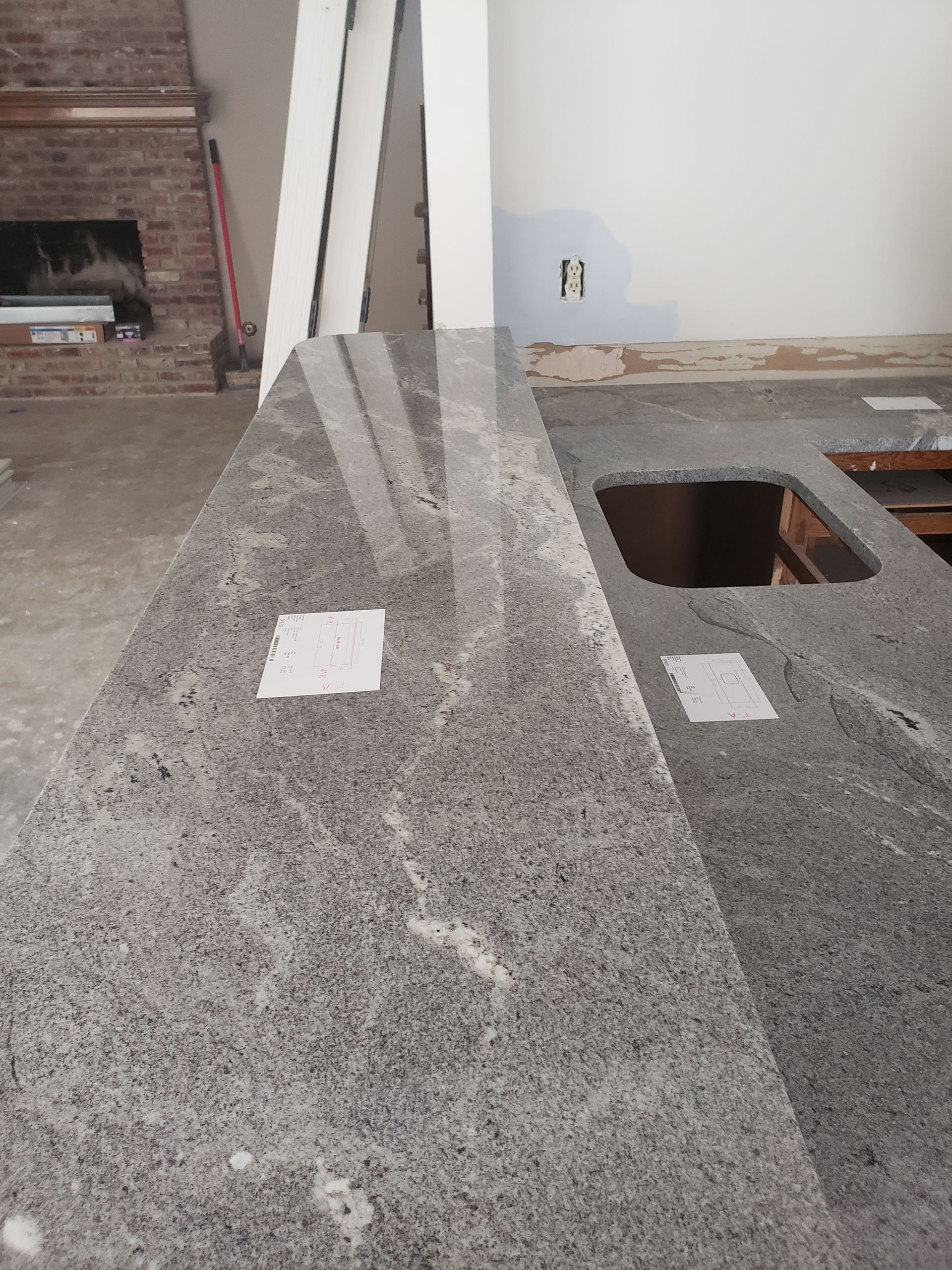 A kitchen with granite counter tops and a sink