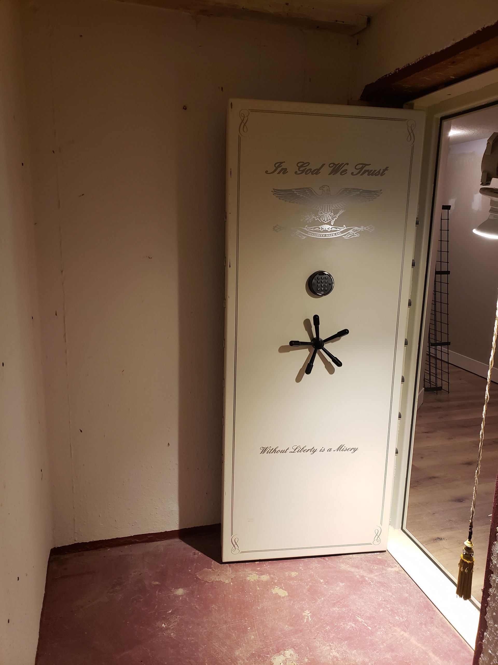 A white door with a star on it is in a room