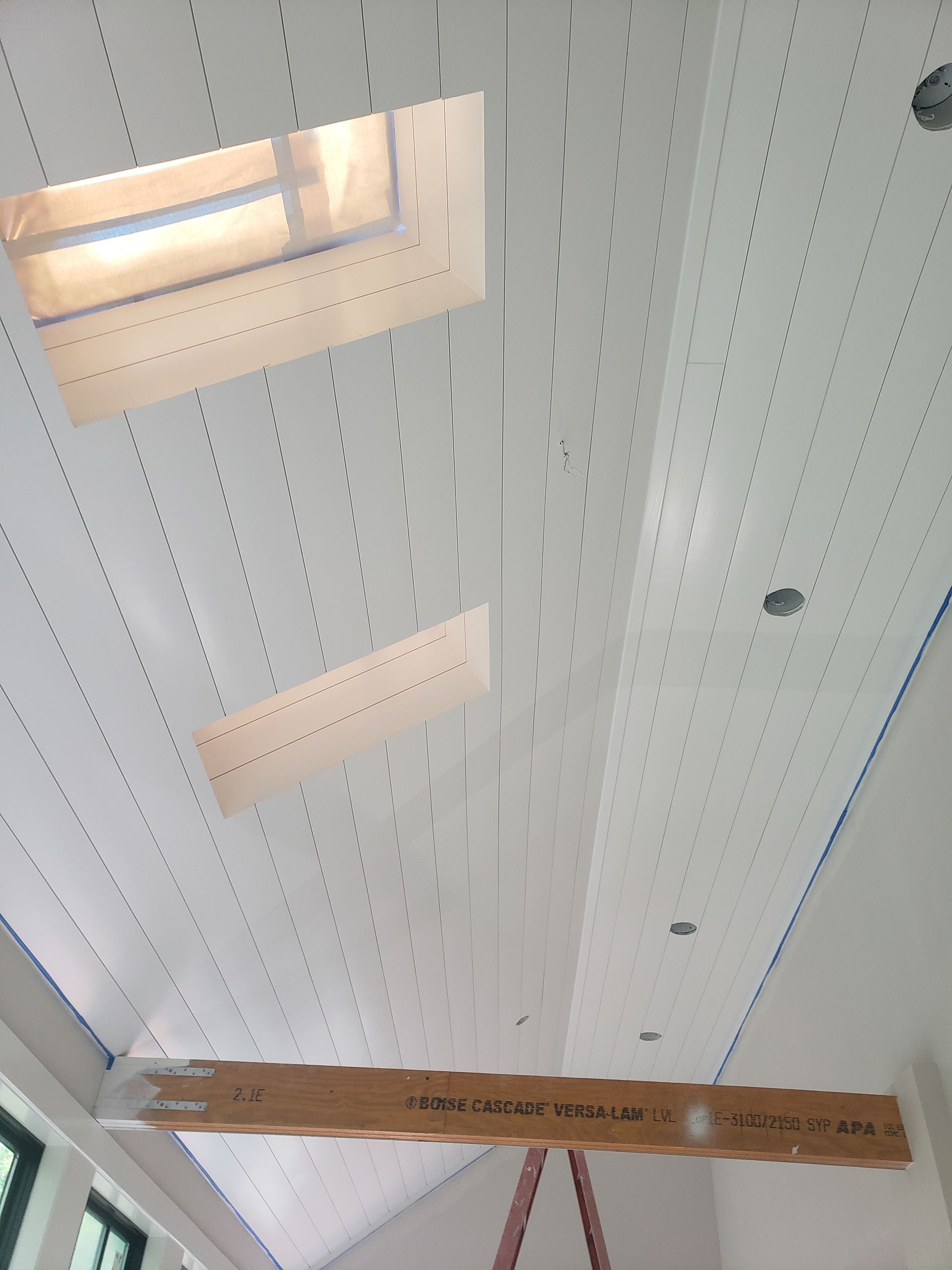 A ladder is hanging from the ceiling of a building