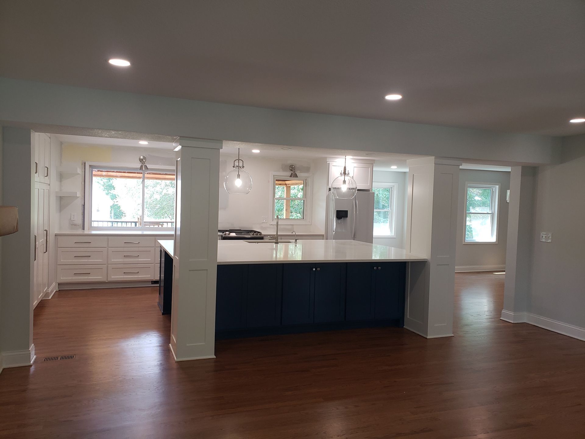 A large kitchen with a large island in the middle of the room.