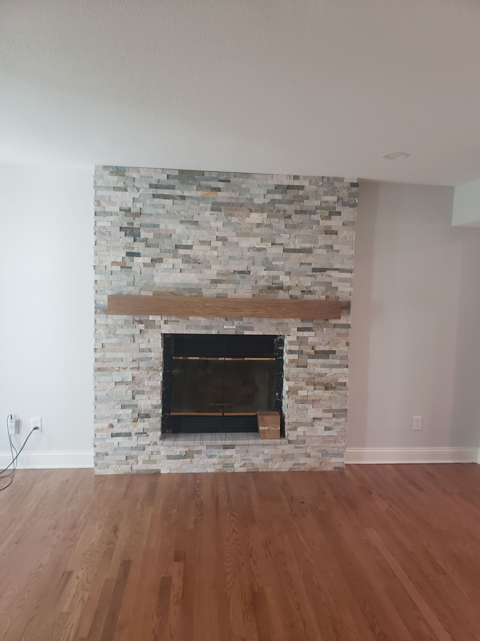 There is a fireplace in the middle of the room.
