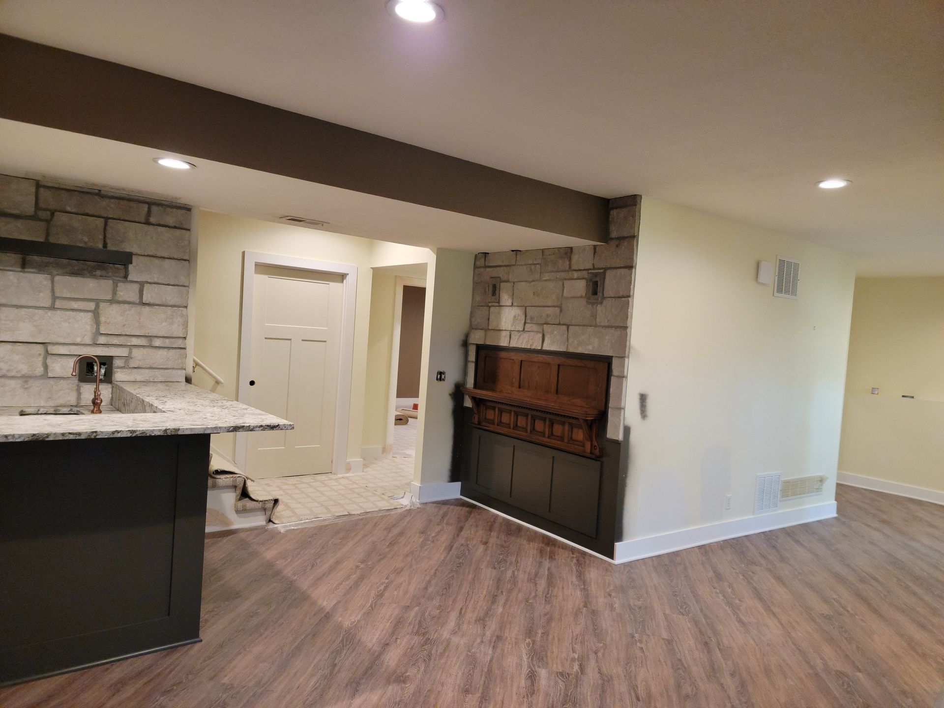 There is a fireplace in the middle of the room.