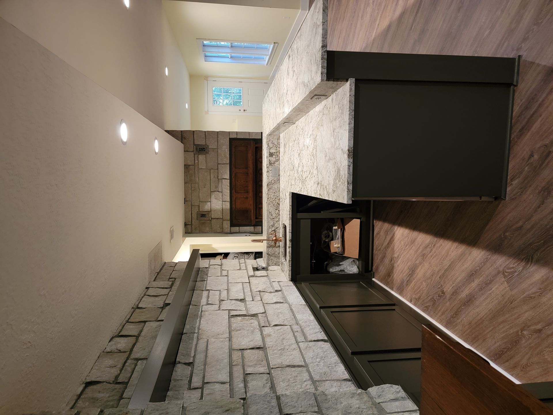 There is a fireplace in the middle of the room.