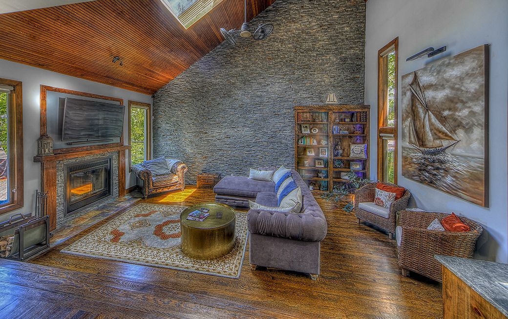 A living room filled with furniture and a fireplace.