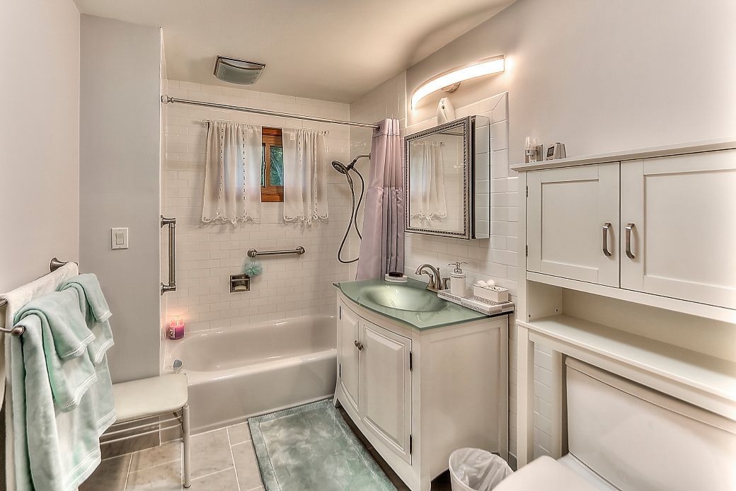 A bathroom with a sink , toilet , and bathtub.
