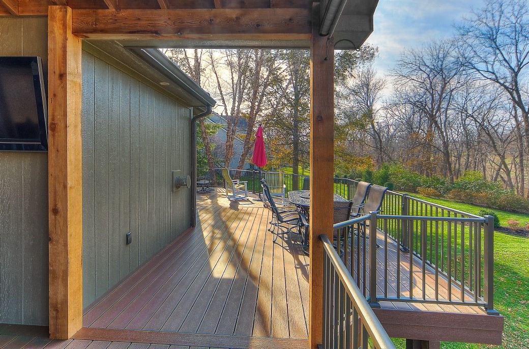 A view of a deck from the inside of a house.