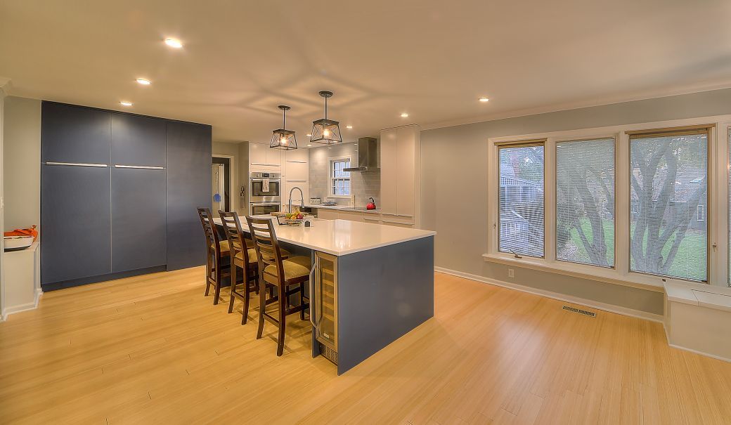 There is a large island in the middle of the kitchen.