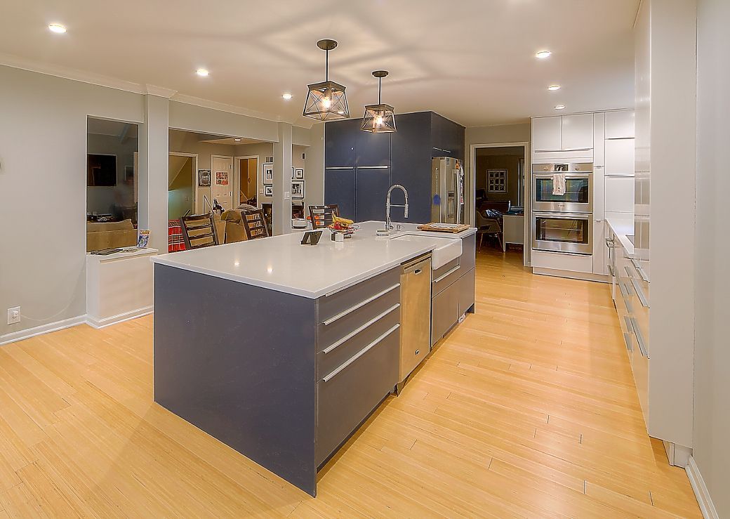 There is a large island in the middle of the kitchen.