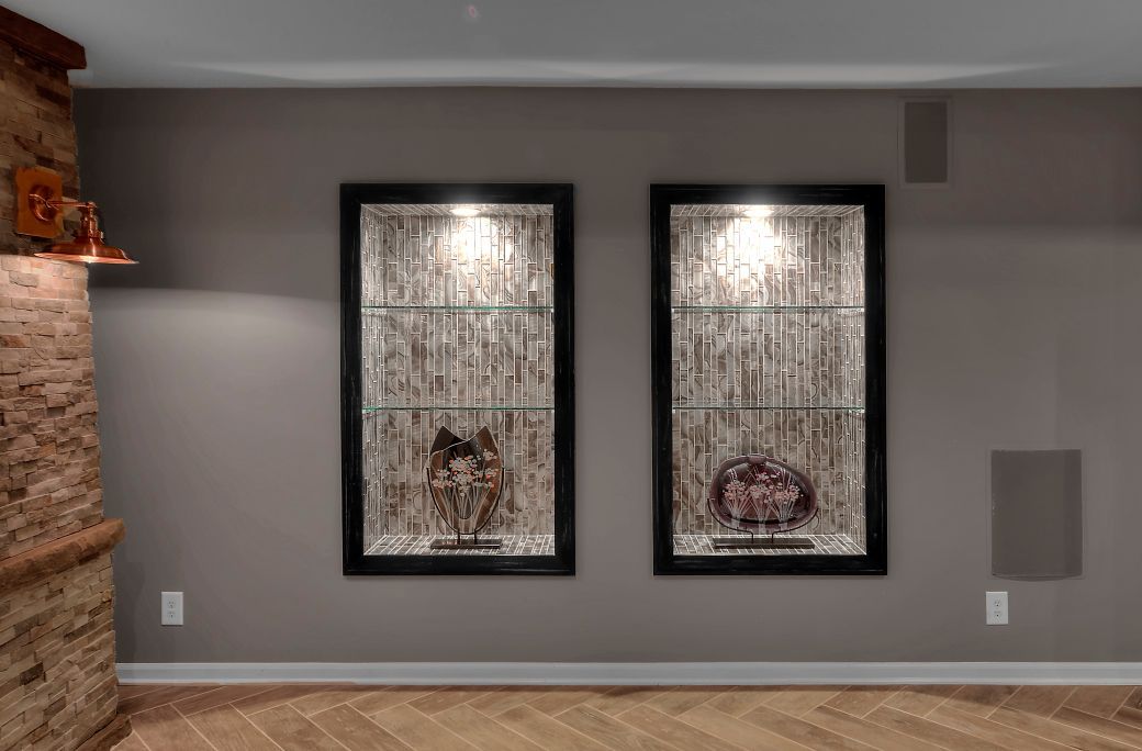 A living room with two framed pictures on the wall.