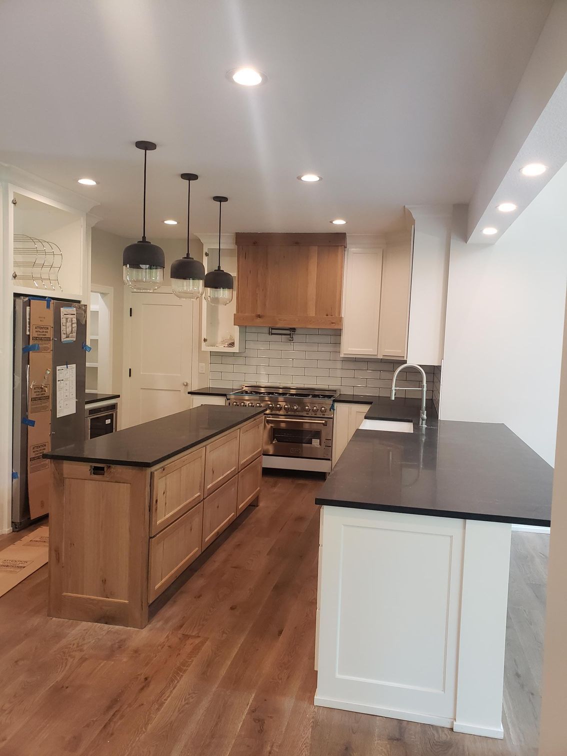 A kitchen with a large island in the middle of it.