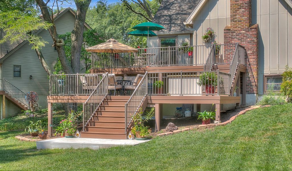 A house with a large deck and stairs leading up to it