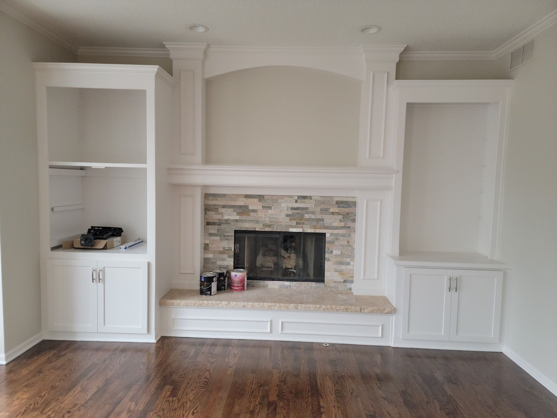 There is a fireplace in the middle of the room.