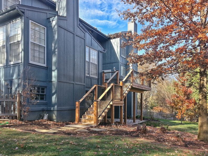 A large house with stairs leading up to the second floor