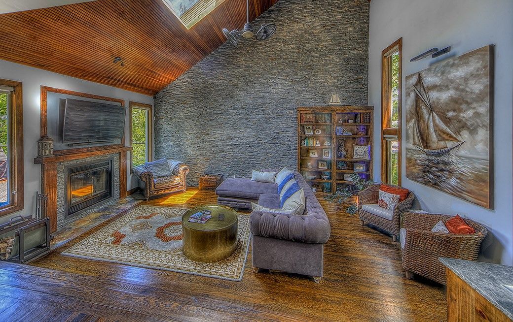 A living room filled with furniture and a fireplace.