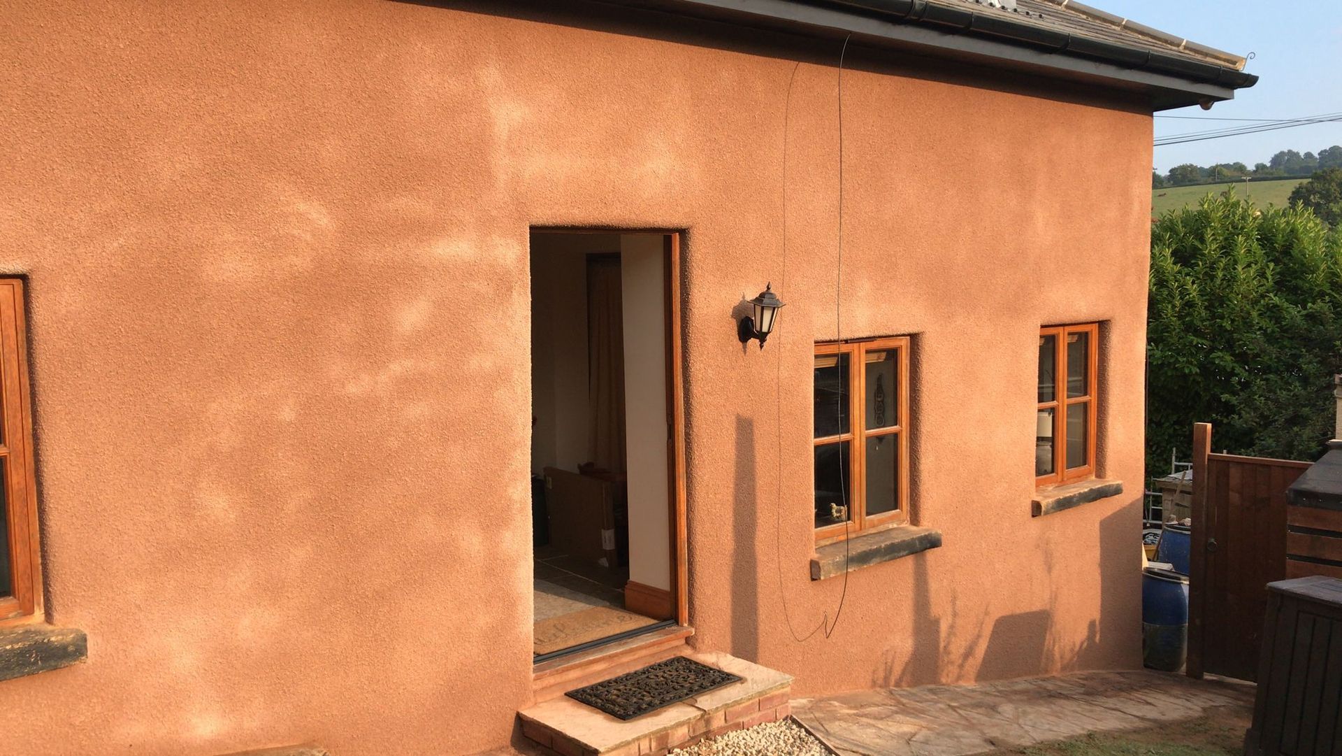 The front of a house with a door and windows.
