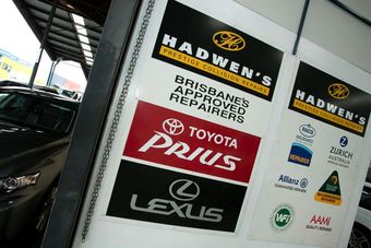 various car brand logos on wall