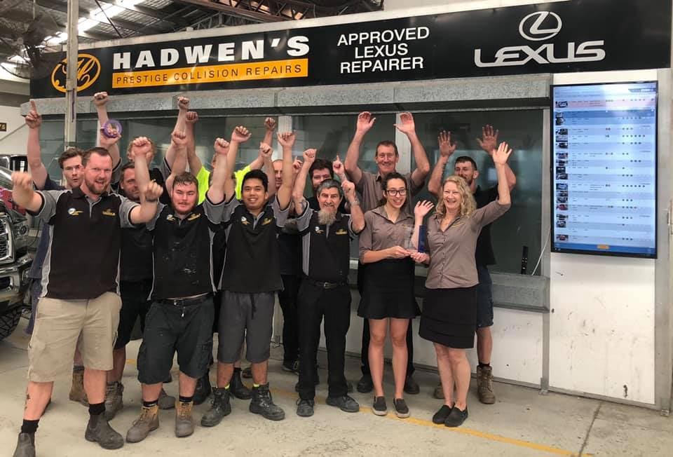 group photo of excited mechanics
