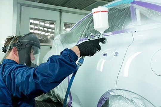 person painting car