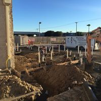 Man and excavator on a construction site — Corsicana, TX — AKV Plumbing Co