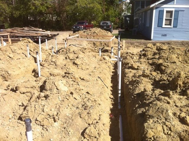Installing white pipe — Corsicana, TX — AKV Plumbing Co