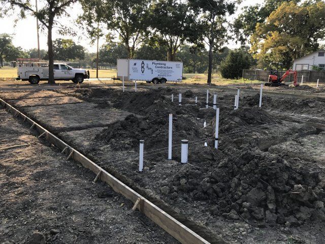 AKV plumbing contractors car on a construction site — Corsicana, TX — AKV Plumbing Co