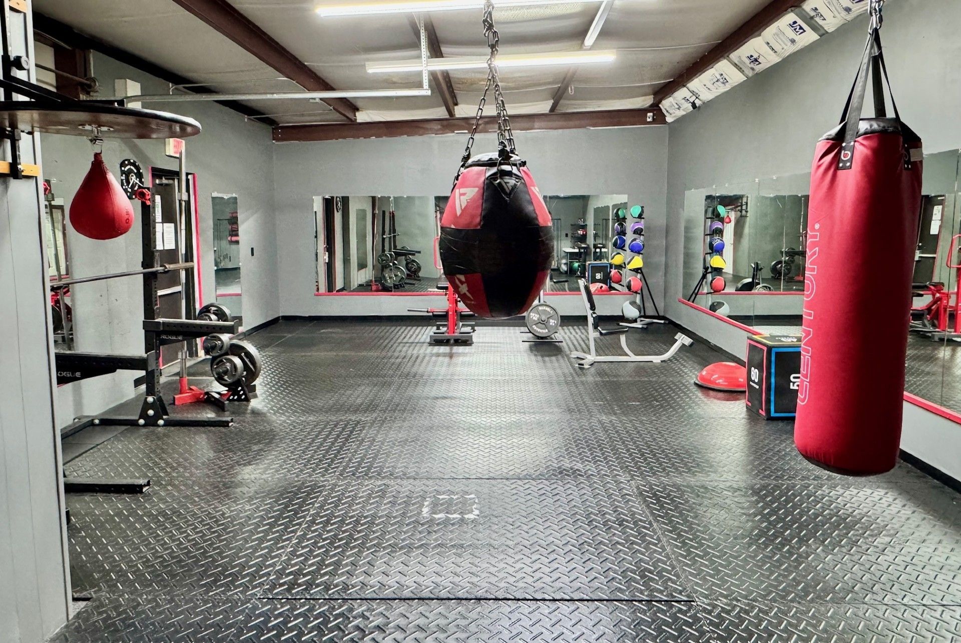 A gym with a sign that says revolution fitness