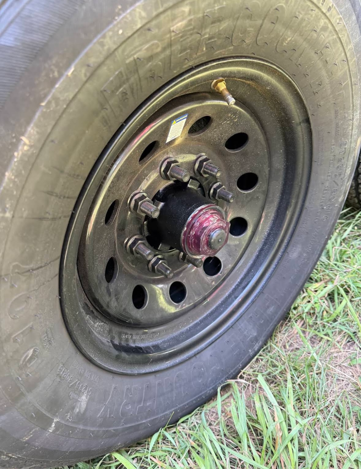 A person is fixing a brake disc on a car.
