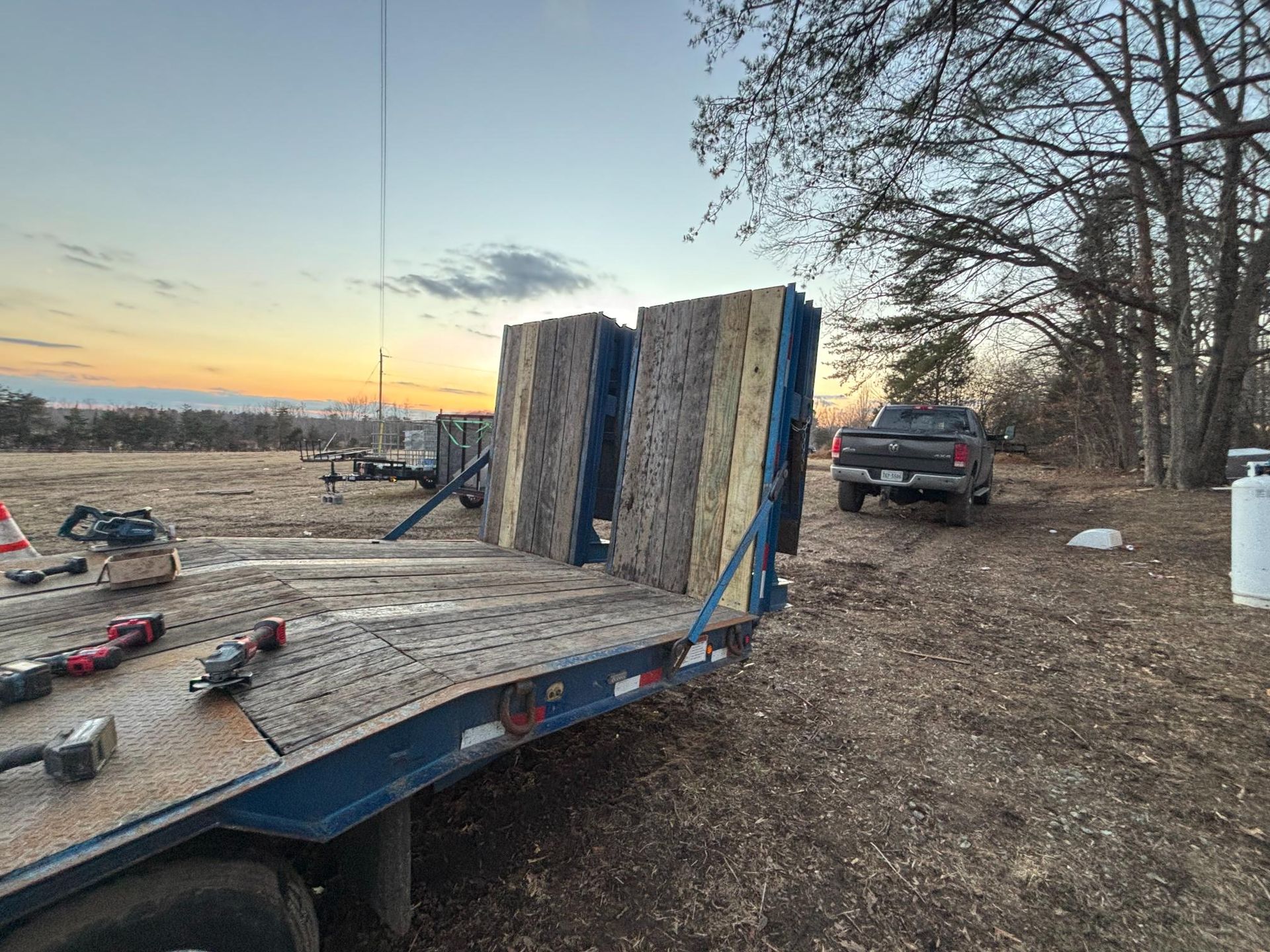 A large container is sitting on a ramp in front of a building
