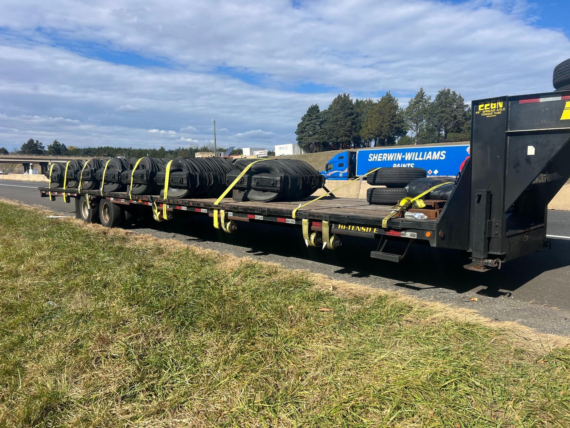 An empty room with a lot of pipes hanging from the ceiling