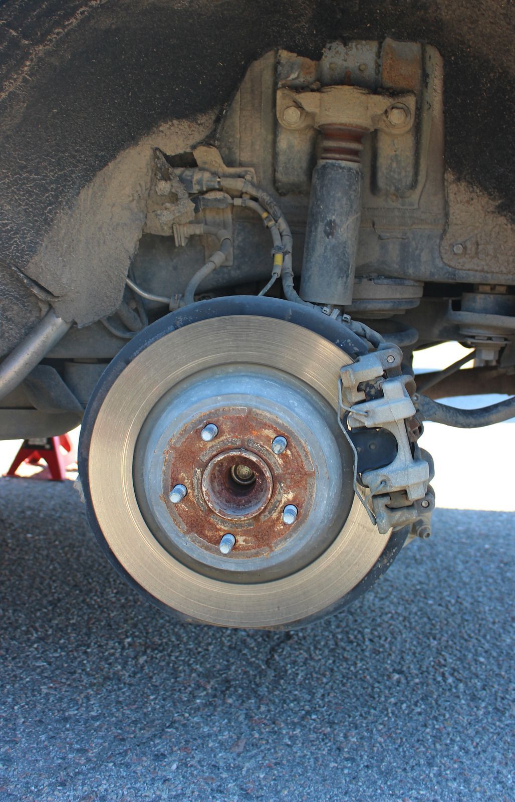 A close up of a brake disc on a car.